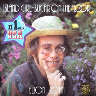 Elton John » Island Girl Lyrics